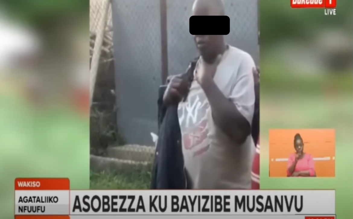 A screen shot of a Bukedde TV story showing a man (with face blacked out) being arrested at a primary school in Uganda.