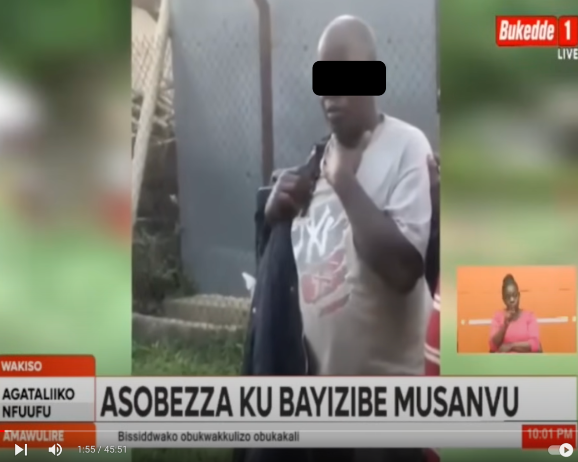 A screen shot of a Bukedde TV story showing a man (with face blacked out) being arrested at a primary school in Uganda.